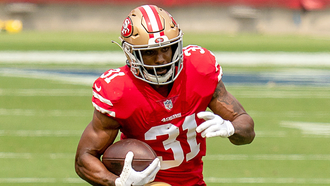 San Francisco 49ers running back Raheem Mostert stiff-arms Las