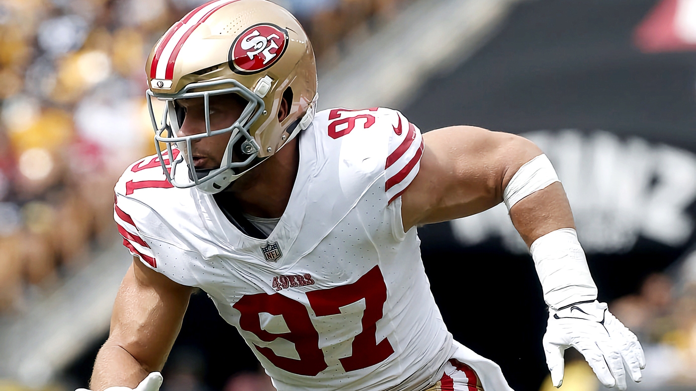 San Francisco 49ers first-round pick Nick Bosa, center, holds up a