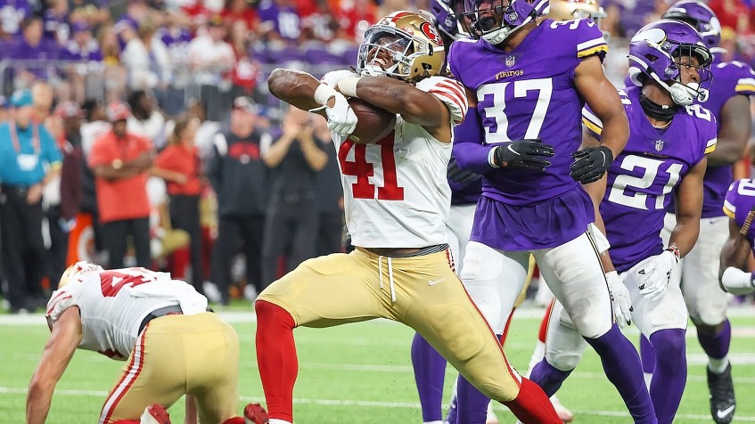 Alex Barrett of the San Francisco 49ers sacks Davis Mills of the