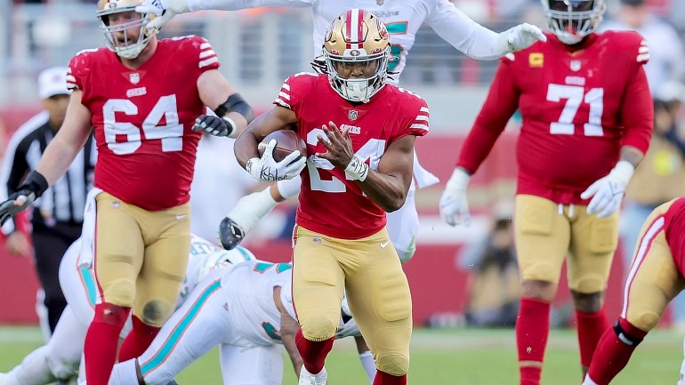 San Francisco 49ers' Jordan Mason takes part in drills at the NFL