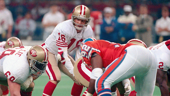 San Francisco 49ers guard Bruce Collie (L) and wide receiver Jerry Rice  during Super Bowl XXIV in New Orleans, Louisiana, January 28, 1990. The  49ers beat the Denver Broncos 55–10. (AP Photo/NewsBase