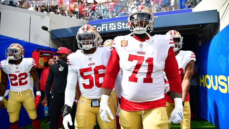 San Francisco 49ers first-round pick Nick Bosa, center, holds up a jersey  next to his mother Cheryl, left, and father John during an NFL football  news conference, Friday, April 26, 2019, in