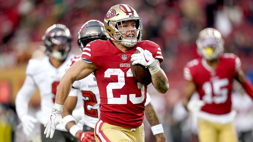 San Francisco 49ers running back Christian McCaffrey (23) sits on the  sideline during an NFL football game against the Denver Broncos, Saturday,  Aug 19, 2023, in Santa Clara, Calif. (AP Photo/Scot Tucker