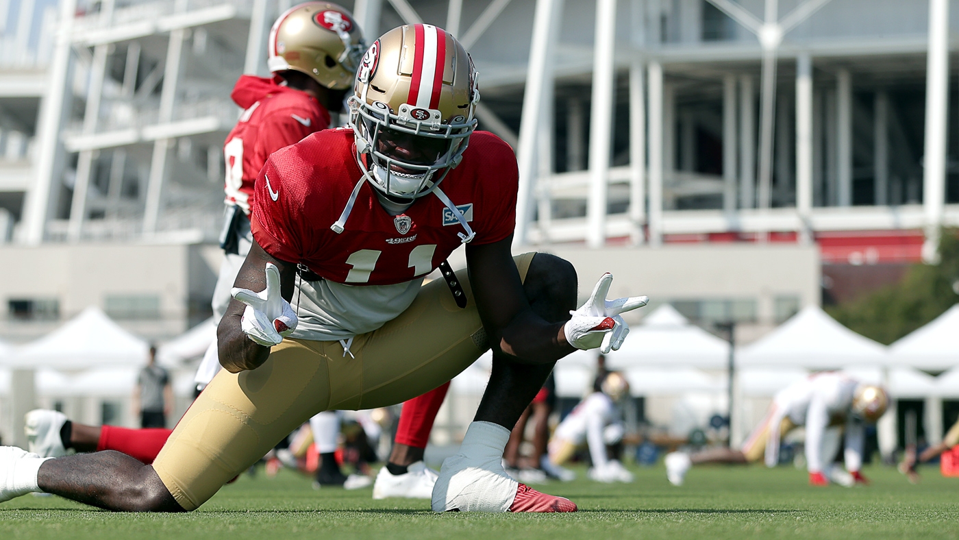 49ers wide receiver Brandon Aiyuk hurdles for touchdown, shows