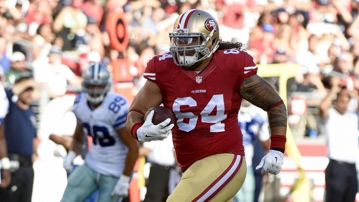 Fullback Bruce Miller of the San Francisco 49ers tries to tackle