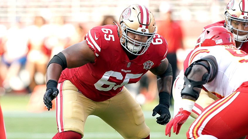 San Francisco 49ers guard Aaron Banks (65) runs on the field during the  first half of