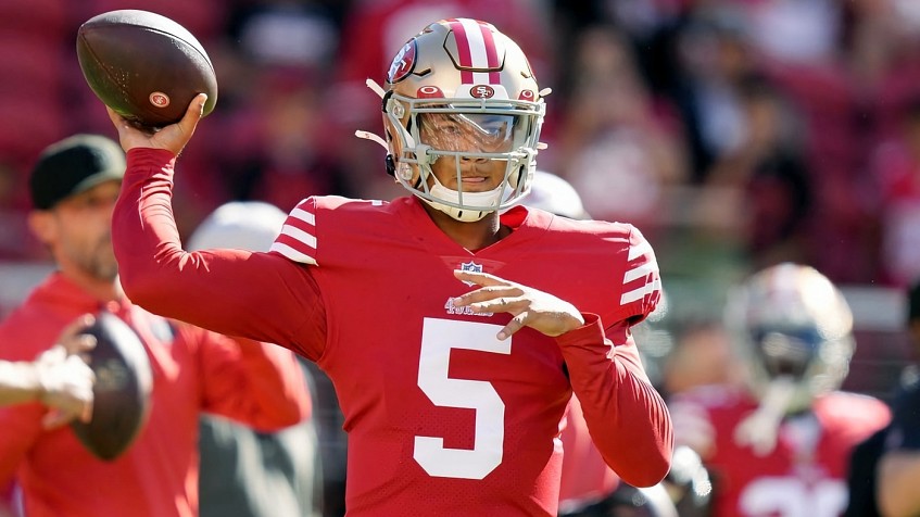 Trey Lance of the San Francisco 49ers passes against Malcolm